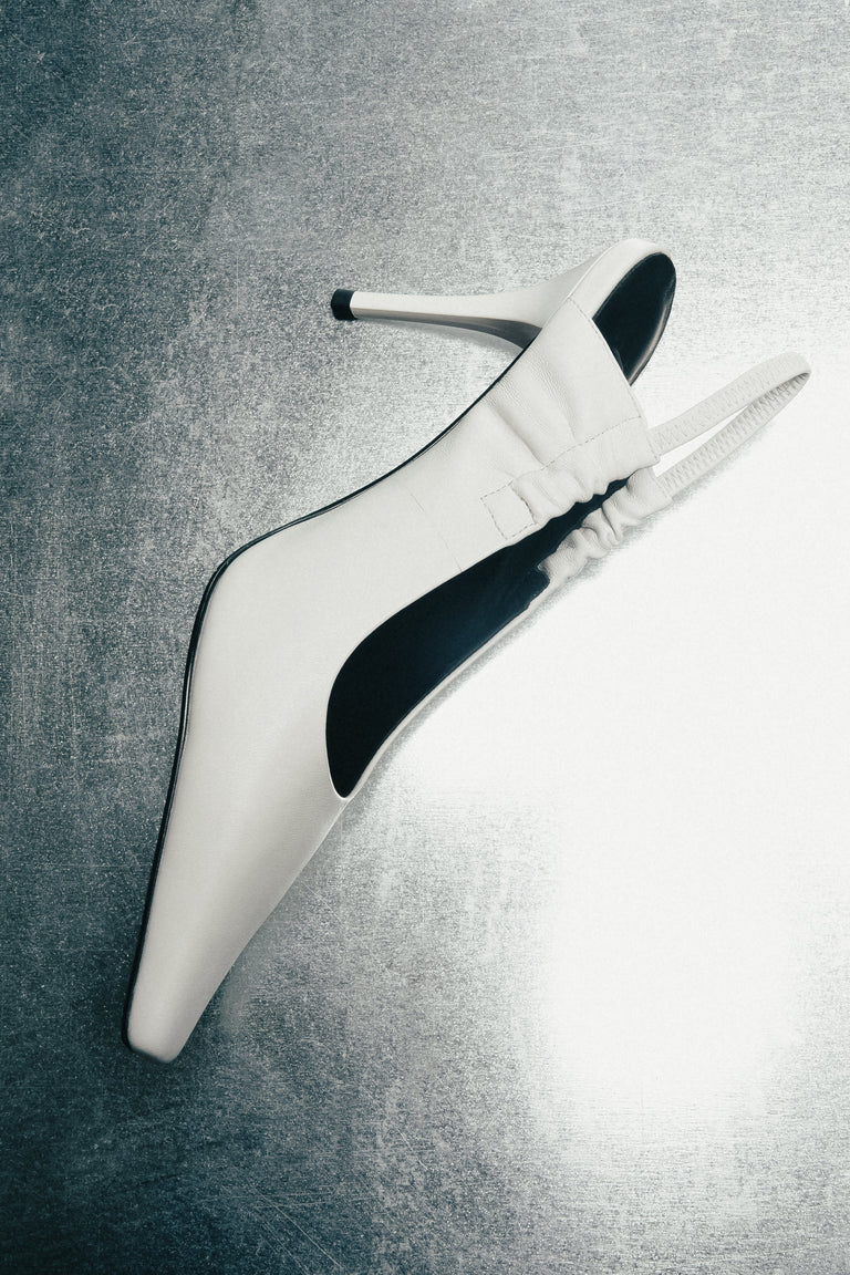 Milky white women’s slingback pumps Estro Selection.
