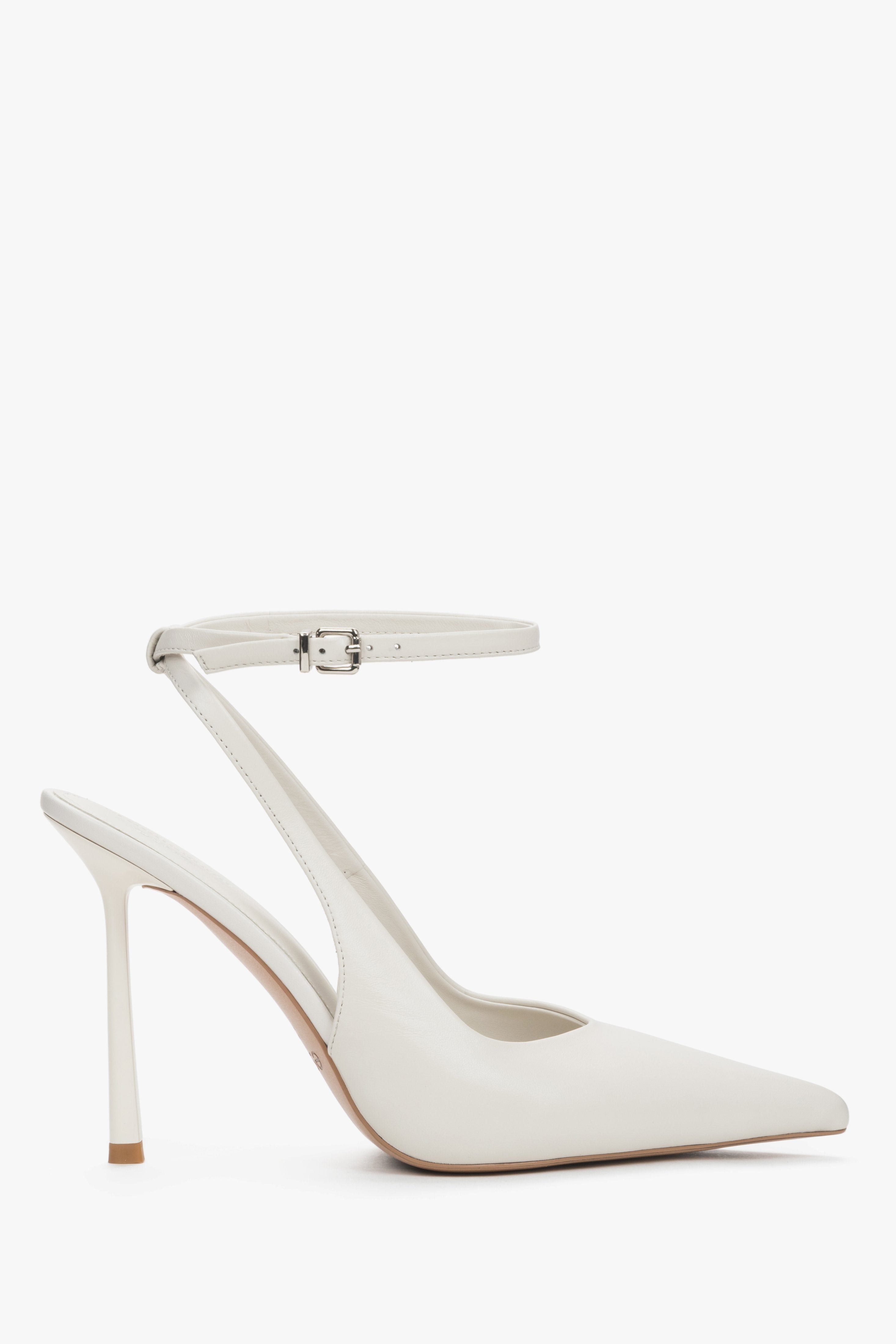 White women’s slingback pumps made of genuine leather.