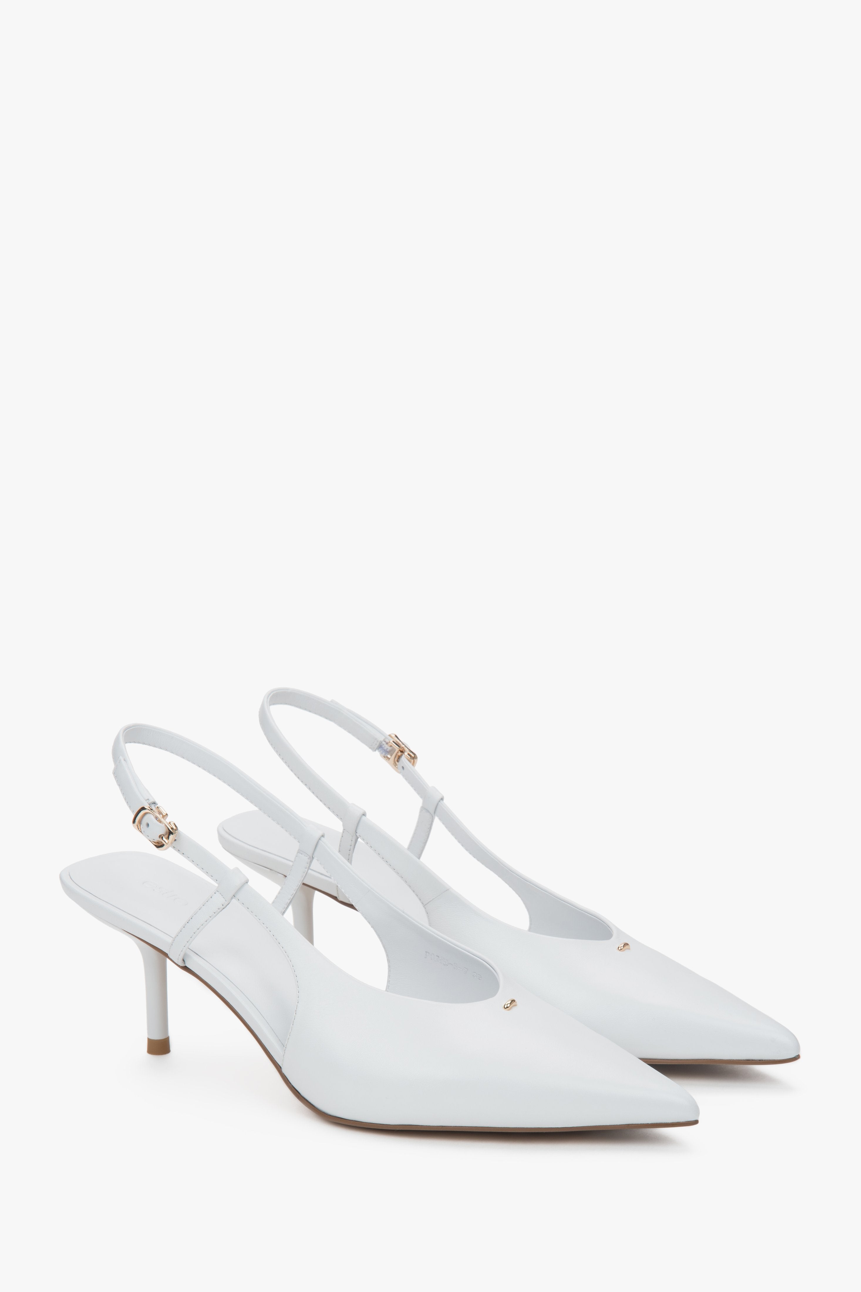 White women’s slingback pumps with an open heel and a stable stiletto heel.
