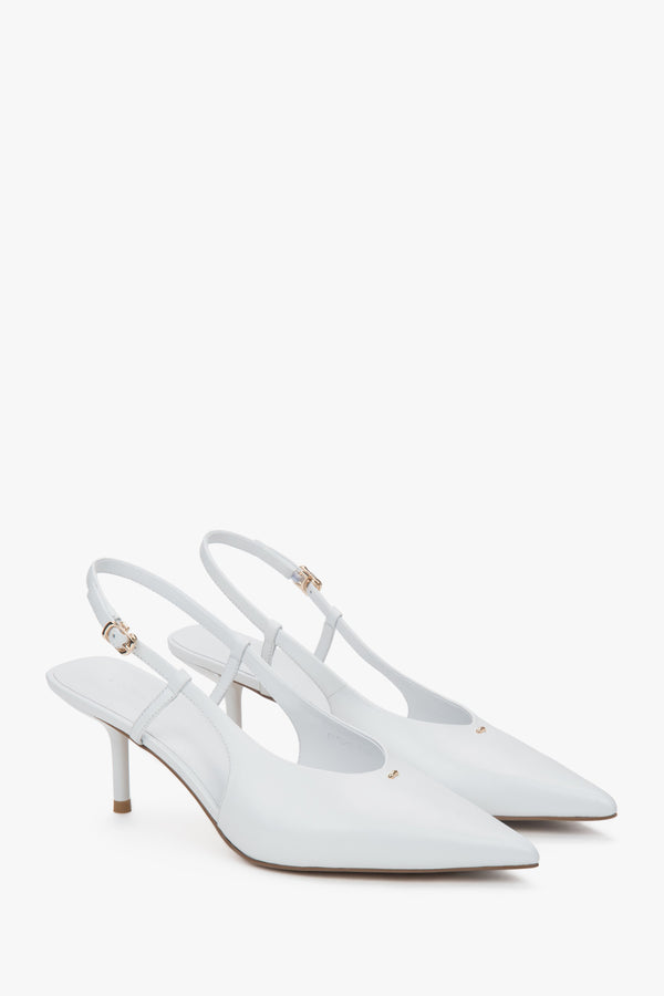 White women’s slingback pumps with an open heel and a stable stiletto heel.