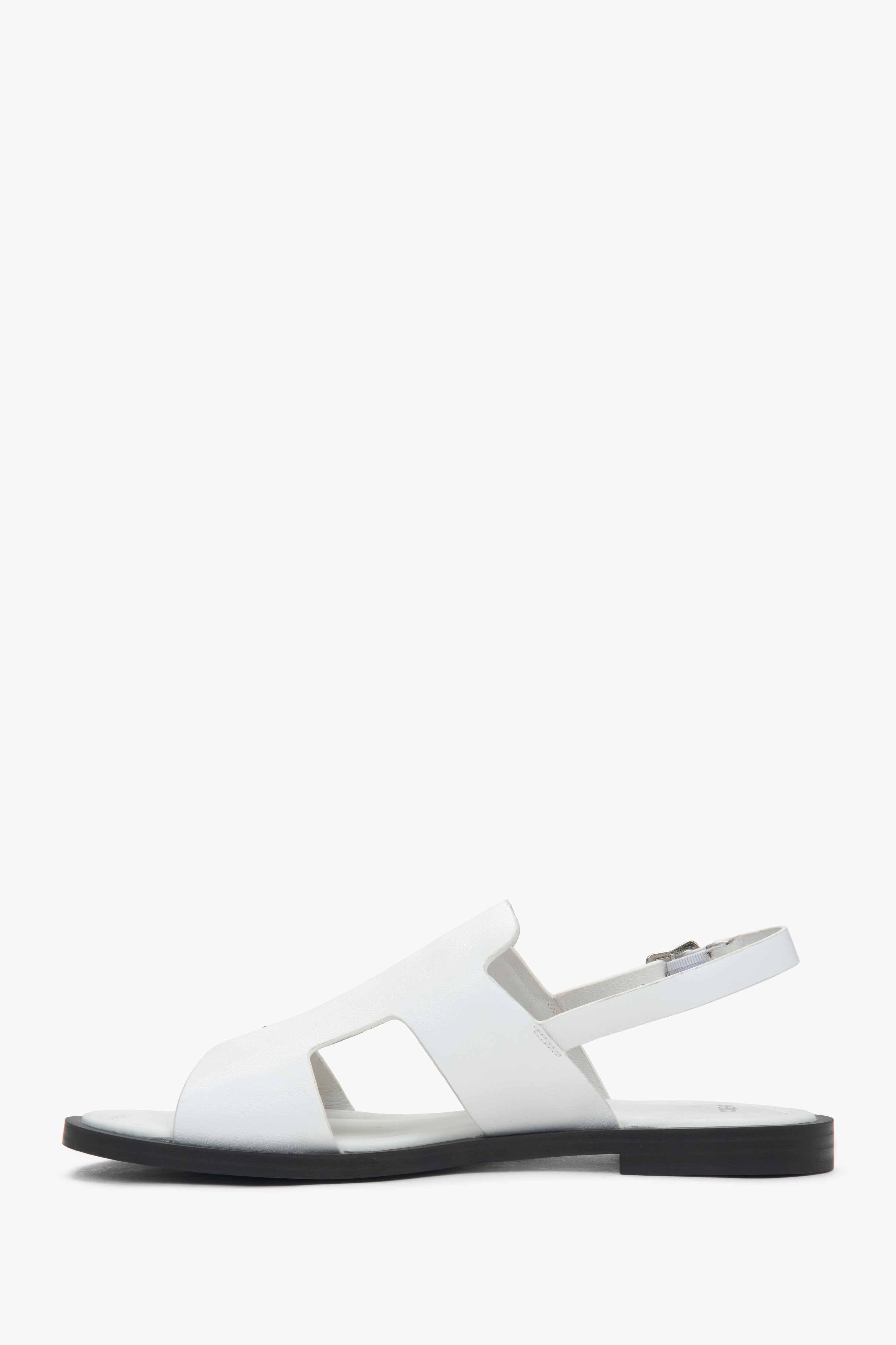 Women’s white closed-toe sandals on a flat natural leather sole by Estro.