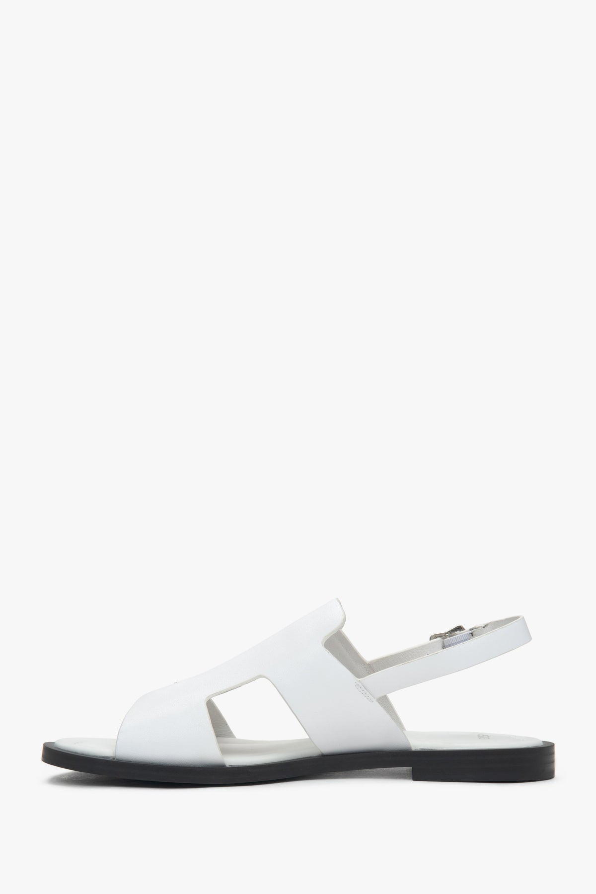 Women’s white closed-toe sandals on a flat natural leather sole by Estro.
