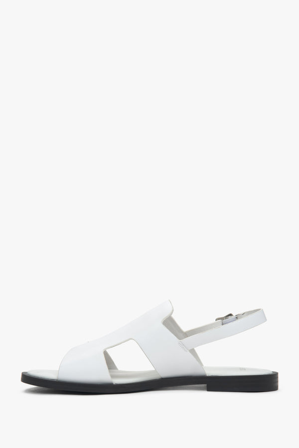Women’s white closed-toe sandals on a flat natural leather sole by Estro.