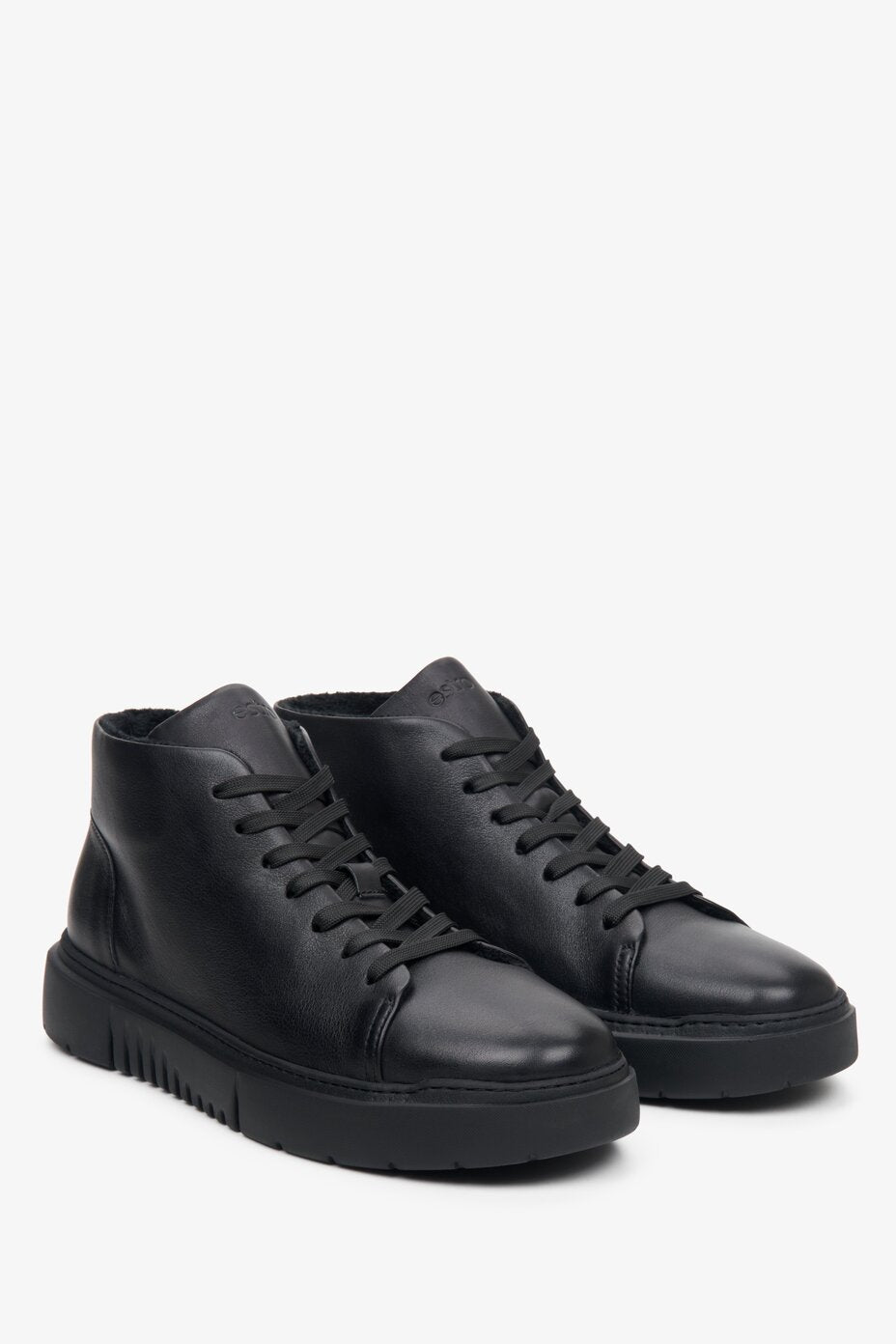 Black, elevated Estro men's sneakers with laces made of genuine leather - presentation of a shoe toe and sideline.