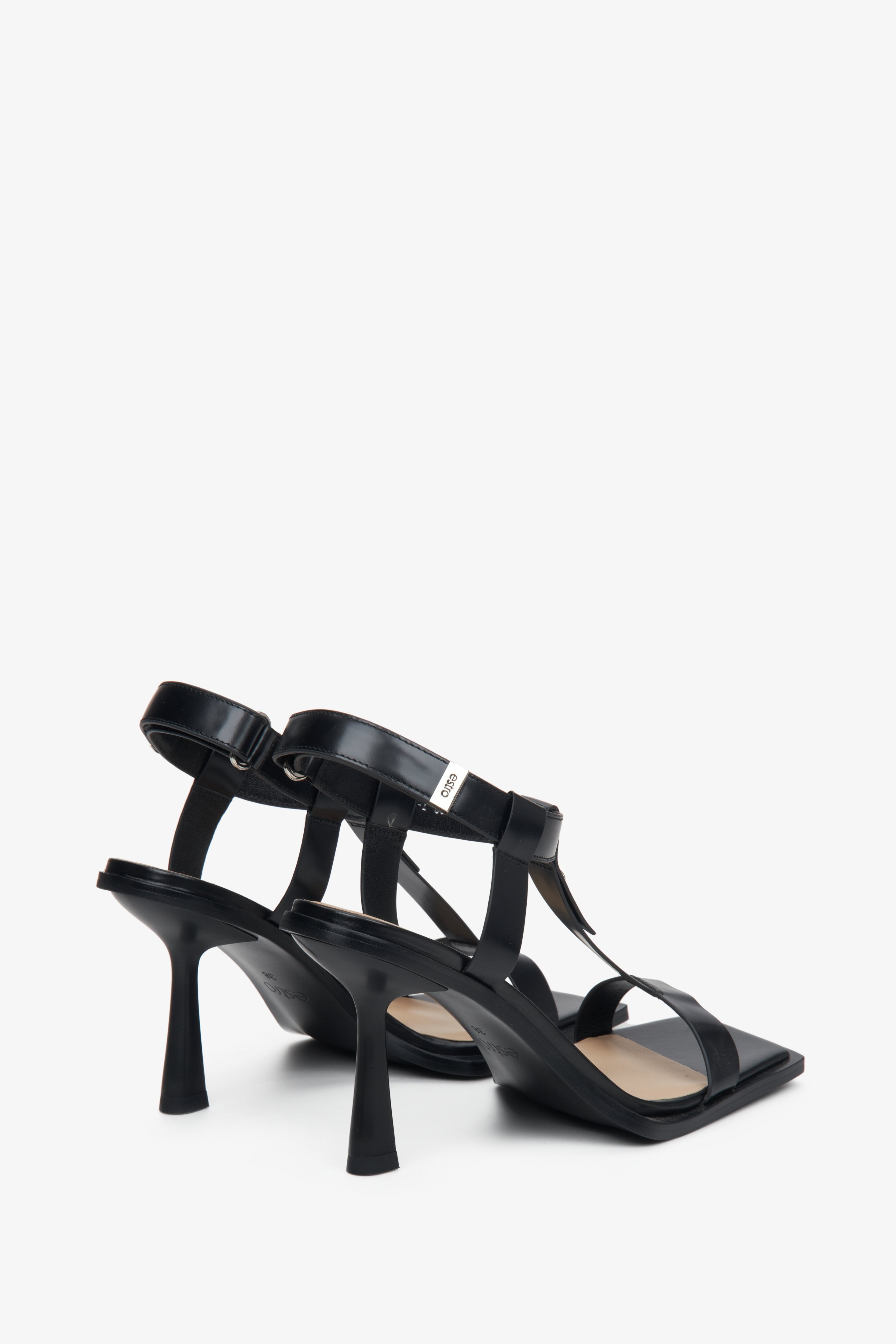 Black women's heeled t-bar sandals, Estro brand.