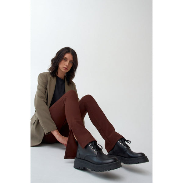 Women's black ankle boots on a platform for fall by Estro - presentation on a model.