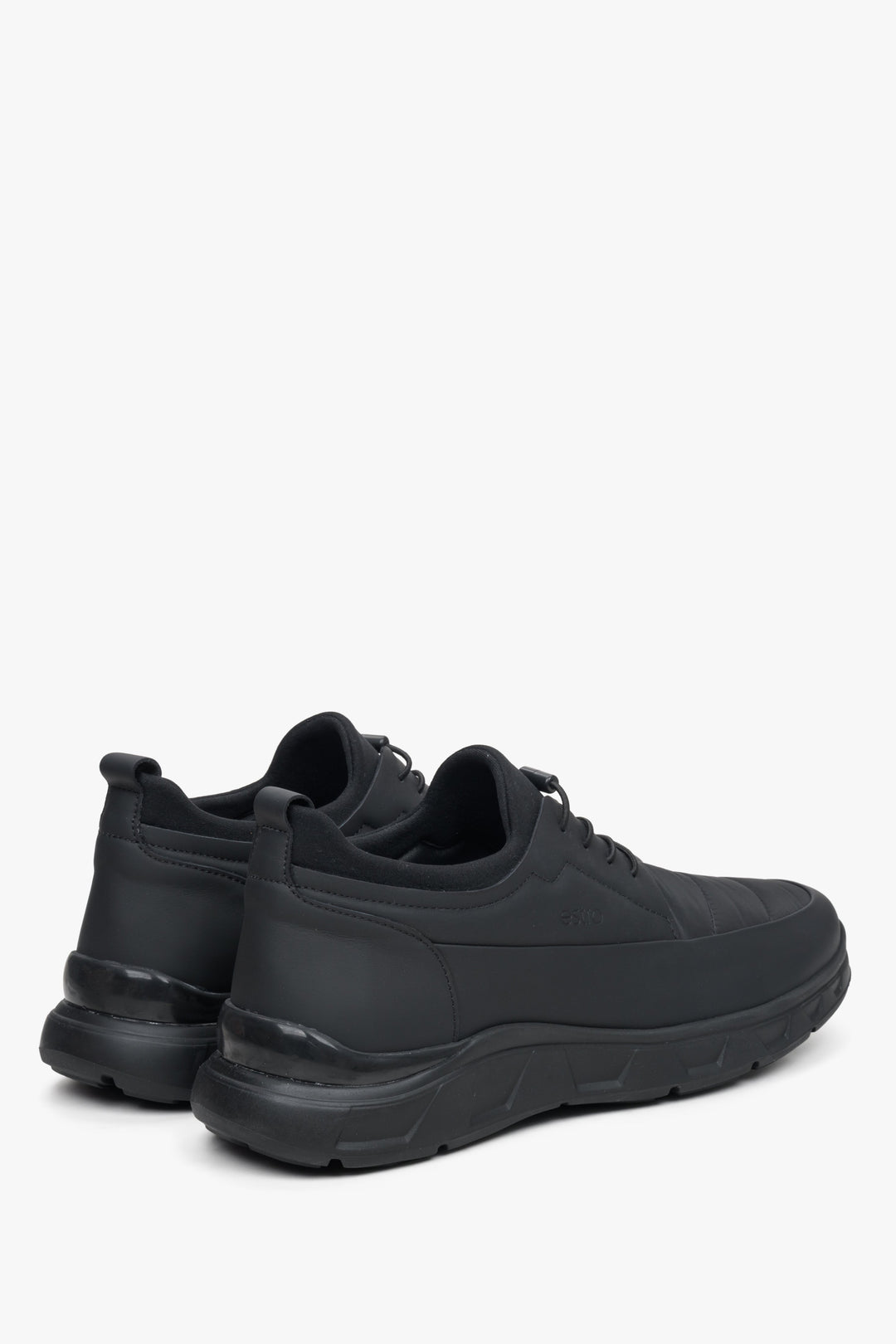 Comfortable men's black  sneakers by Estro - close-up on the side line and soft heel.