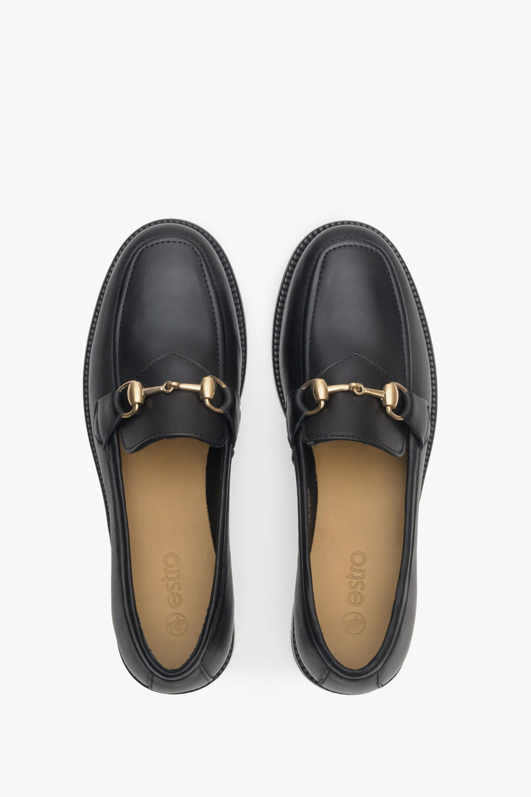 Elegant, black women's loafers made of Italian leather - close-up form above.