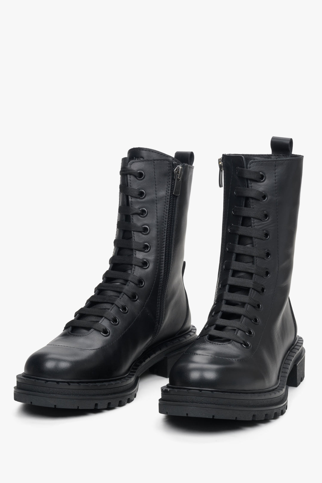 Women's black ankle boots in genuine leather by Estro - close-up on the front of the model.
