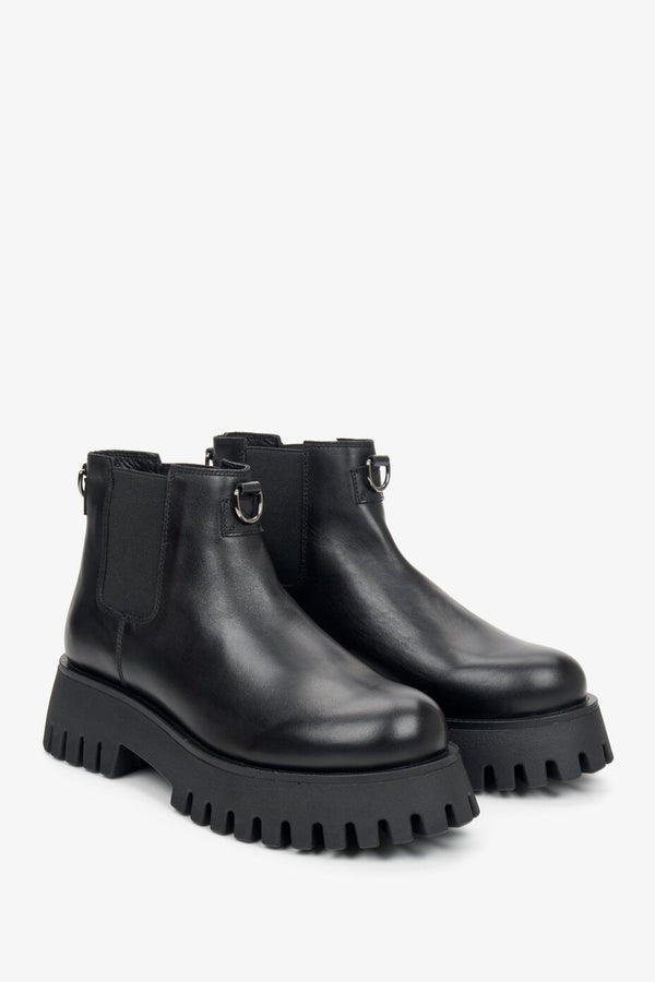 Women's black leather ankle boots with elastic goring - close-up of the front and side of the shoe.