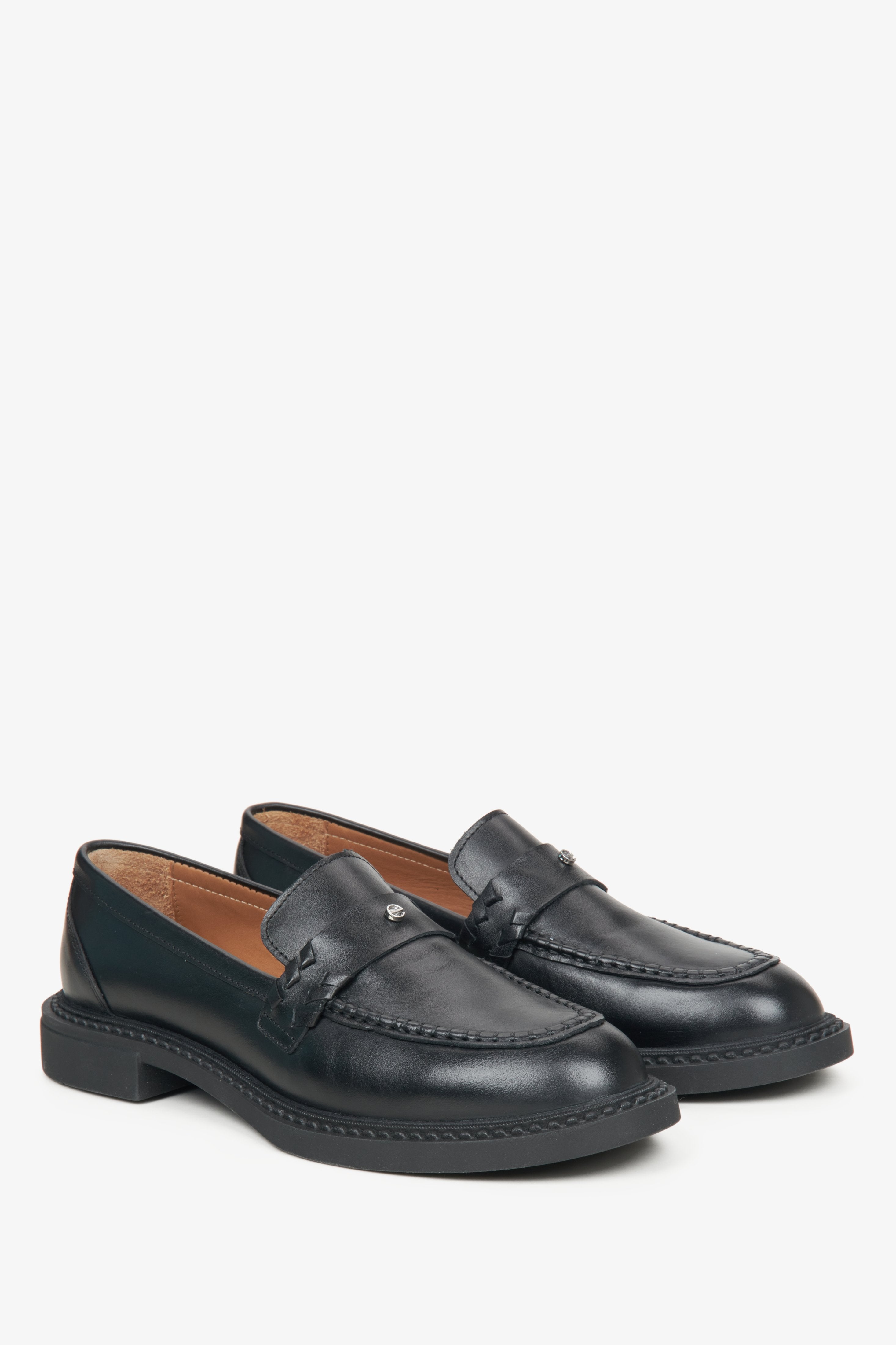 Women's black leather loafers.