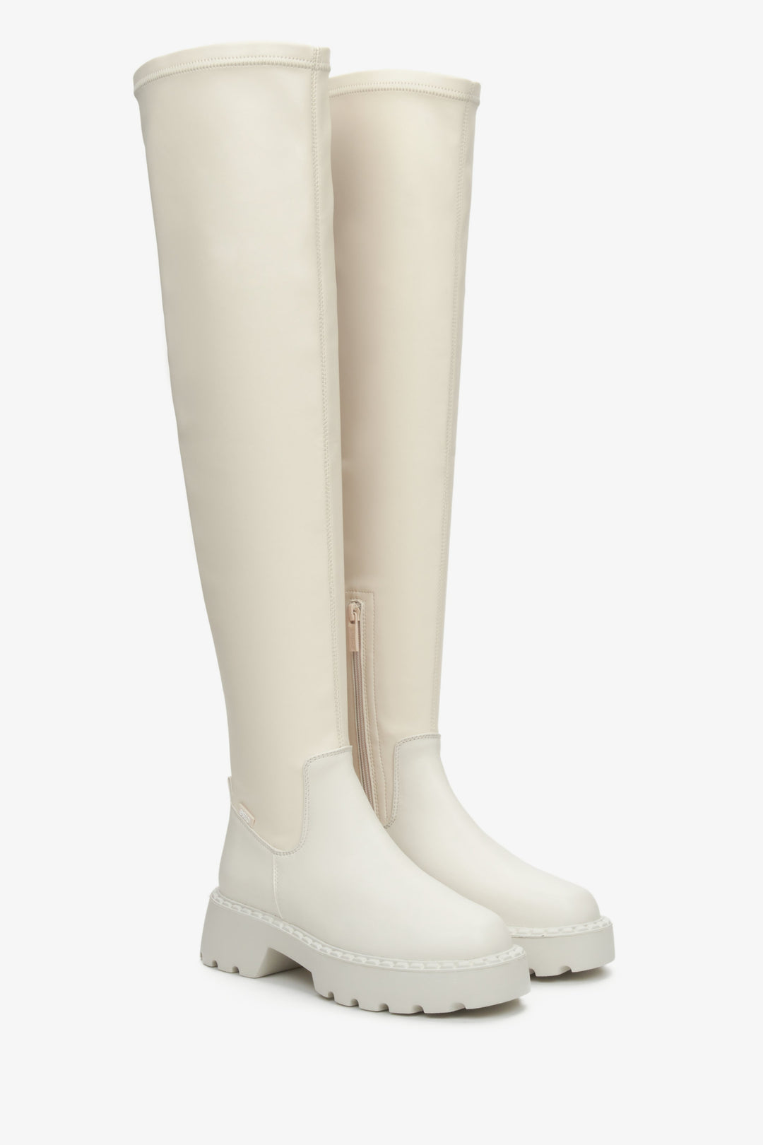 Light beige, high women's boots with an elastic upper by Estro.