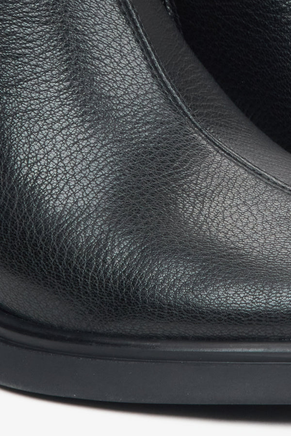 Women's black leather ankle boots by Estro - close-up on the details.