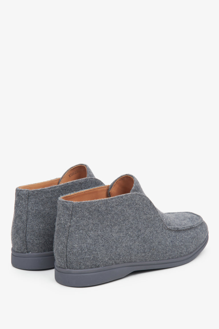 Women's grey moccasins with an elevated upper - close-up on the back of the model.