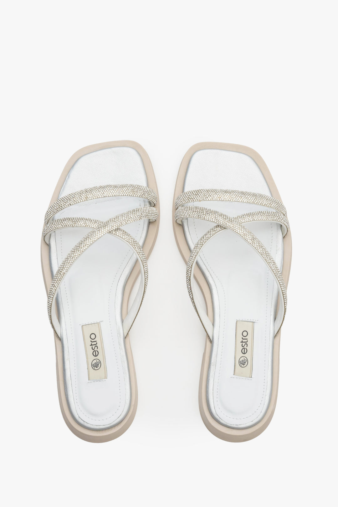 Comfy and stylish women's slide sandals on a flat heel by Estro in silver colour.