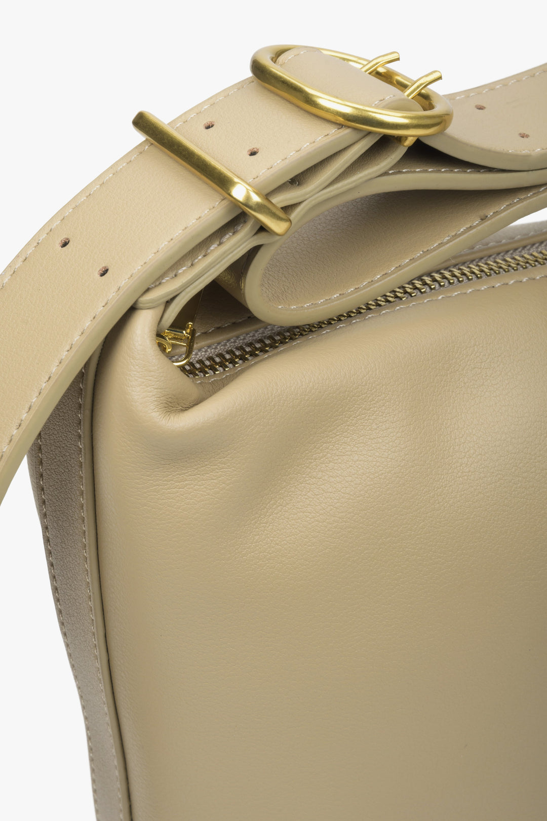 Leather women's bucket-style bag in beige colour.