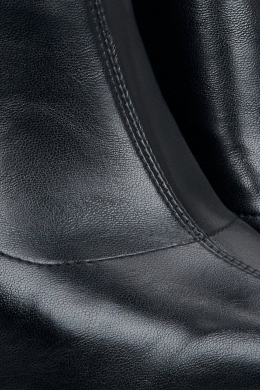 Leather, women's black boots by Estro - close-up on details.