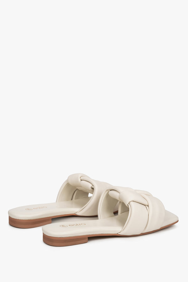 Women's light beige leather slides by Estro with a flat heel.