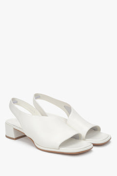 Elegant women's white sandals by Estro, made of genuine leather and set on a comfortable low heel.