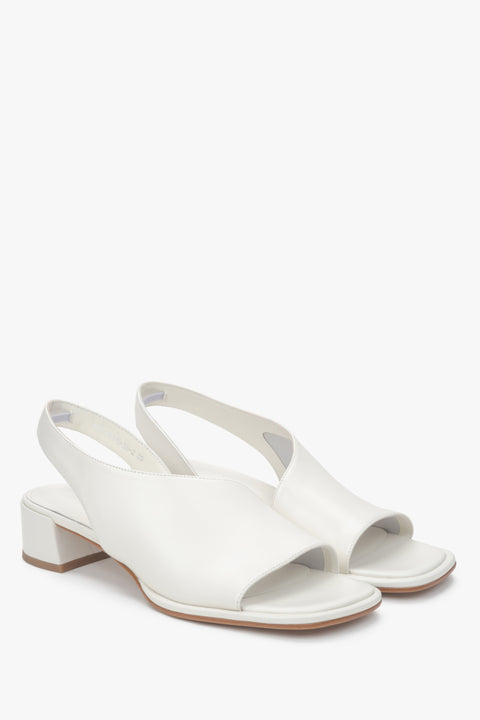 Elegant women's white sandals by Estro, made of genuine leather and set on a comfortable low heel.