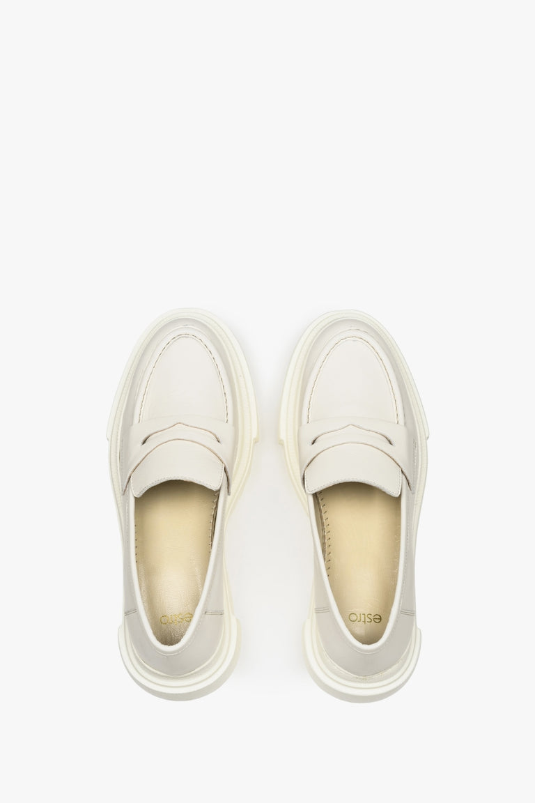 Elegant leather loafers in white - presentation of the footwear from above.