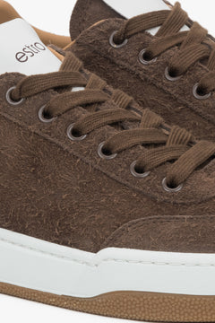 Women's brown sneakers made of genuine velour with a cushioned sole - close-up of the details.