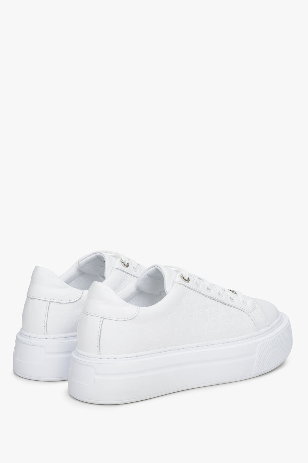 Women's white  leather sneakers by Estro - close-up on the side line and heel counter.