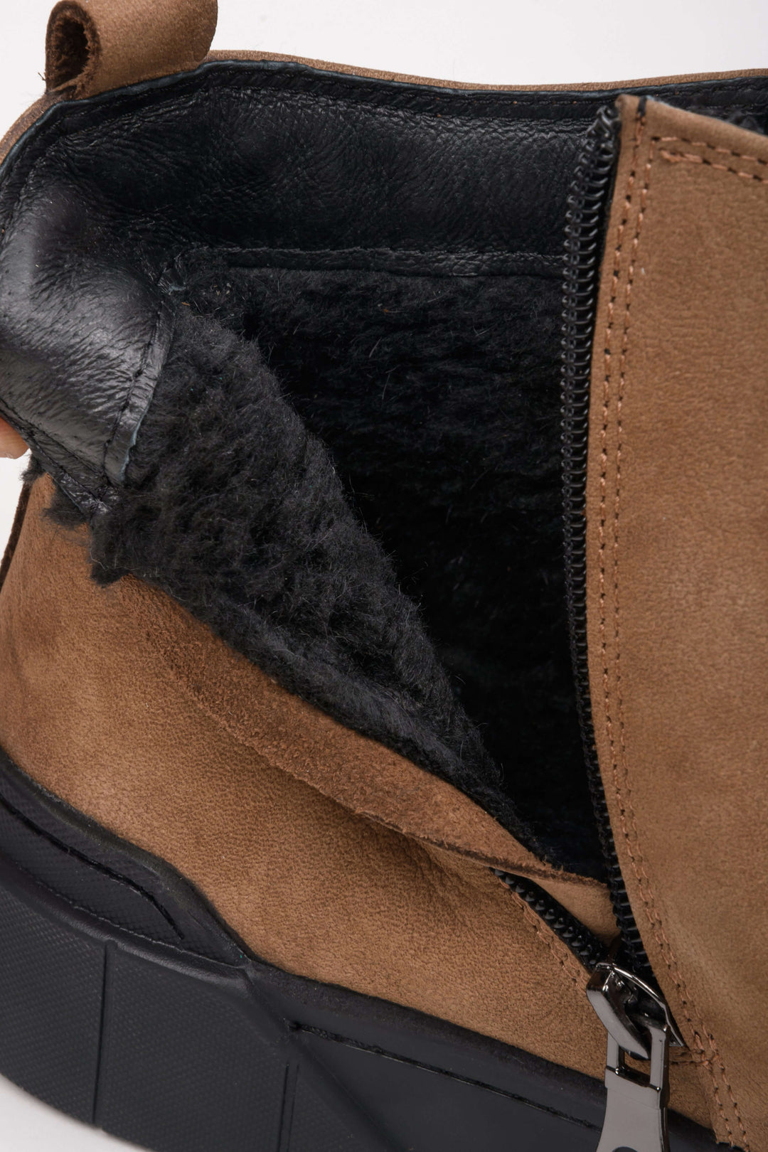 High-top men's sneakers in brown - close-up on the shoe's padding.