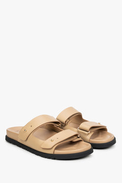 Women's beige leather slides by Estro.