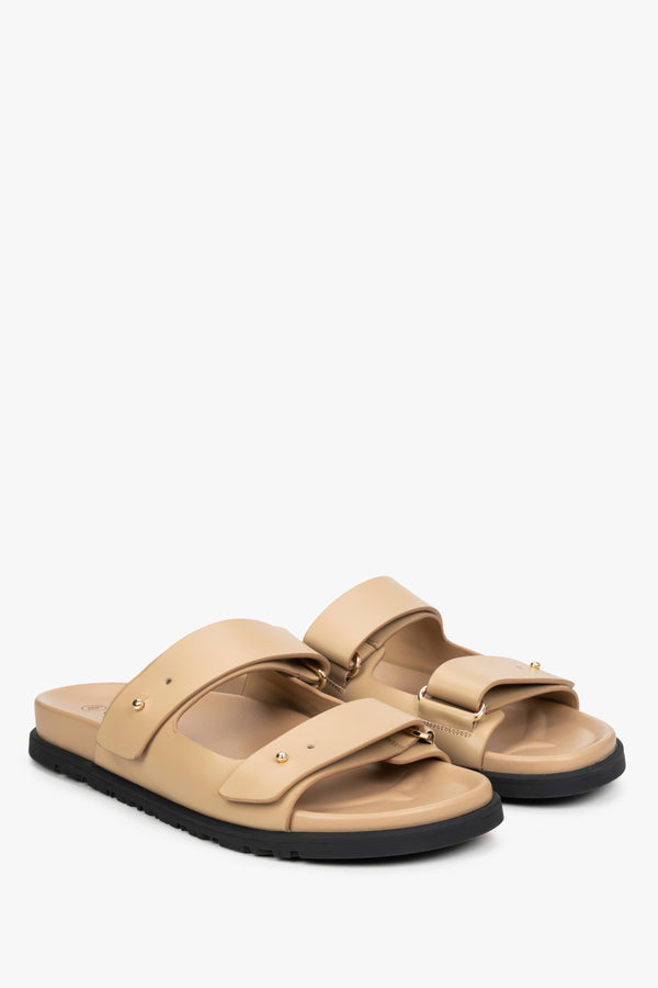 Women's beige leather slides by Estro.