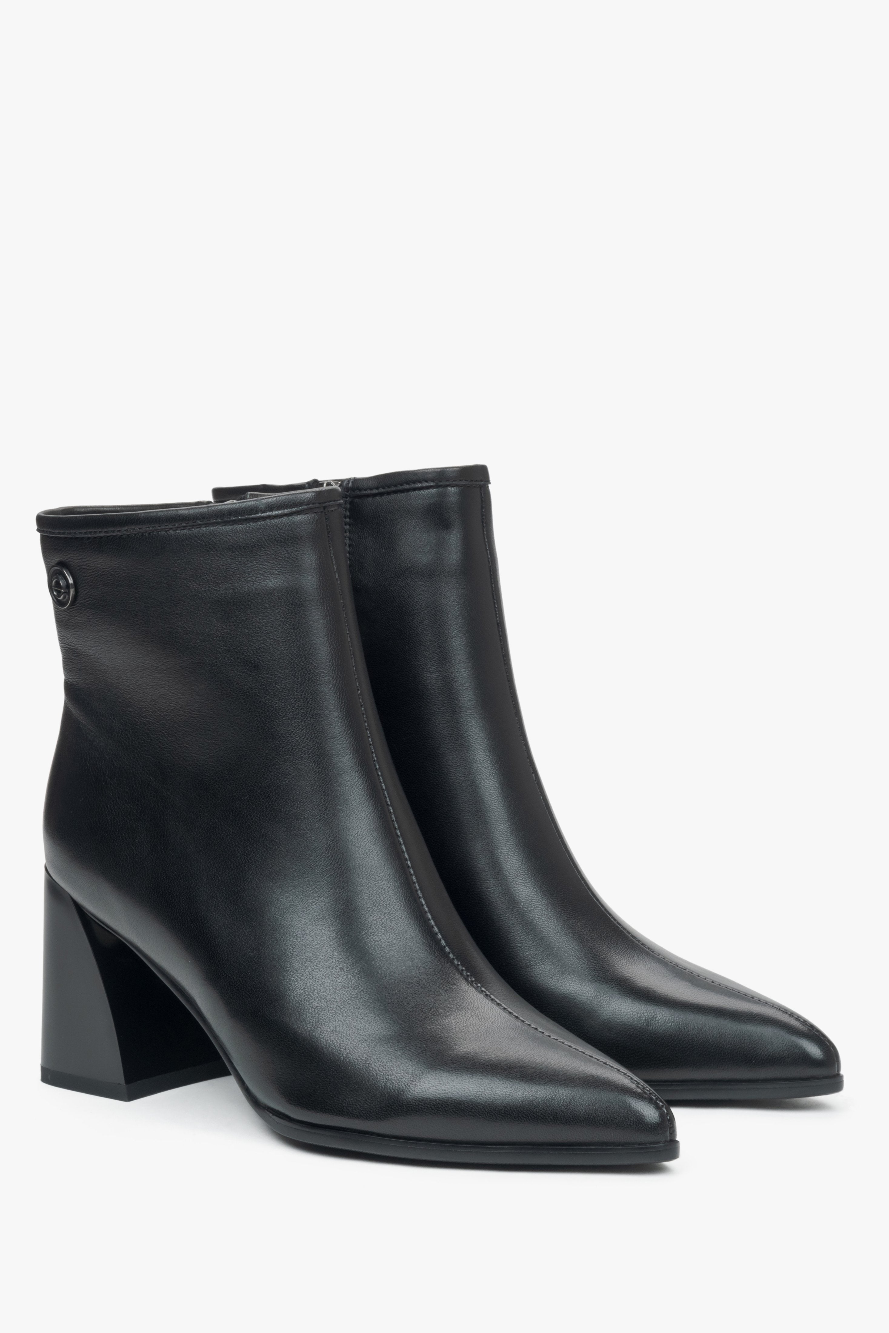 Black leather women's ankle boots with a pointed toe and heel, Estro.