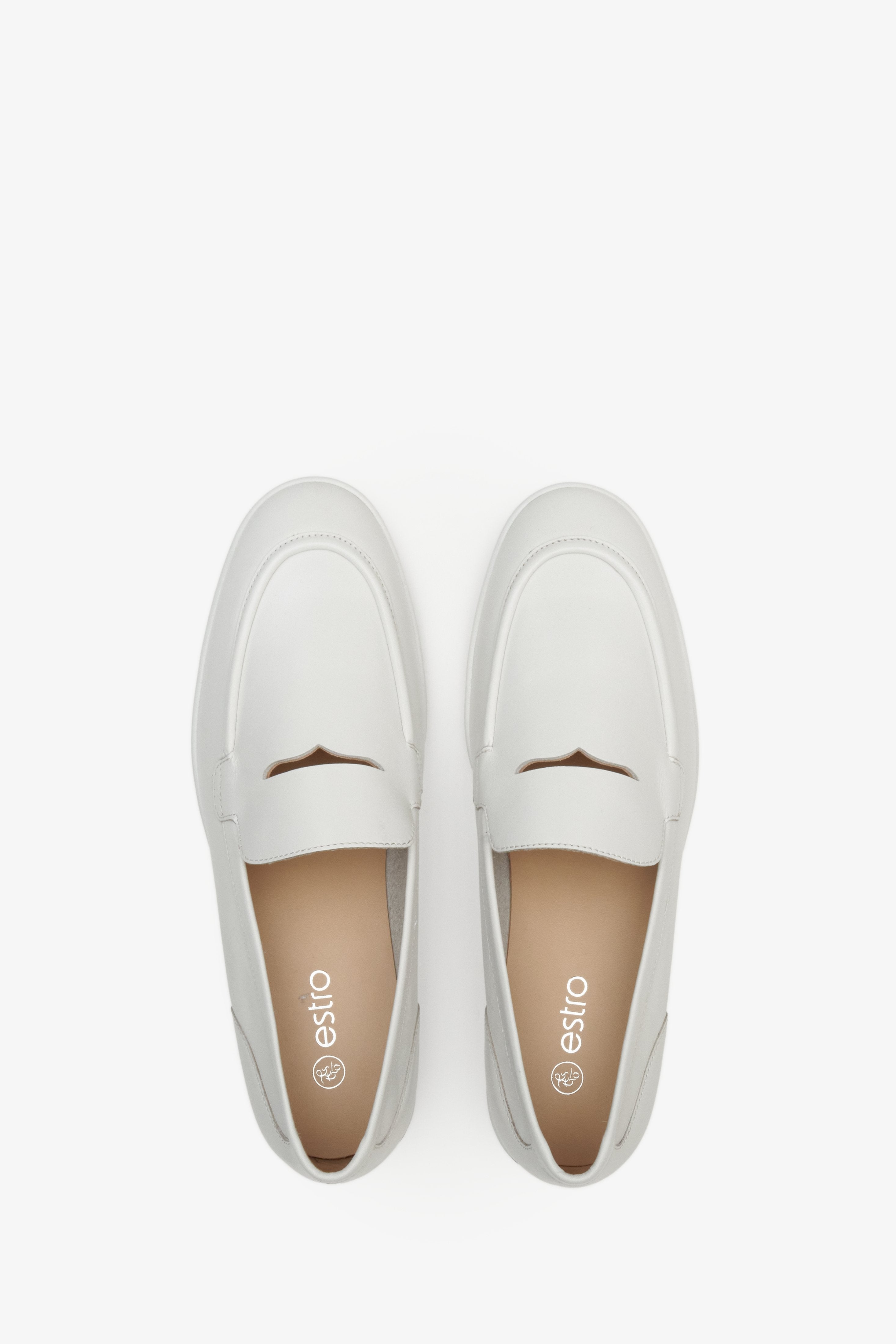 Women's Estro brand white moccasins made of genuine leather - top view presentation of footwear.