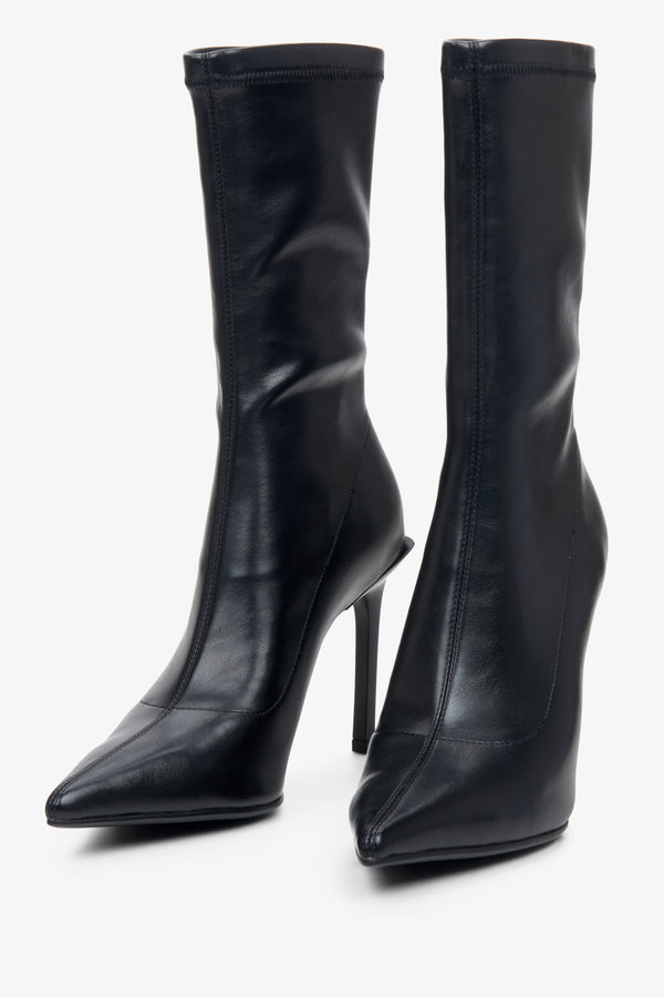 High-heeled women's boots in black by Estro - close-up on the toe of the shoe.