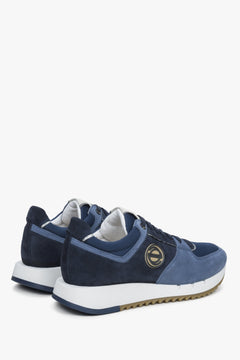 Men's black and blue  velour sneakers - close-up on the heel and side line of the shoes.