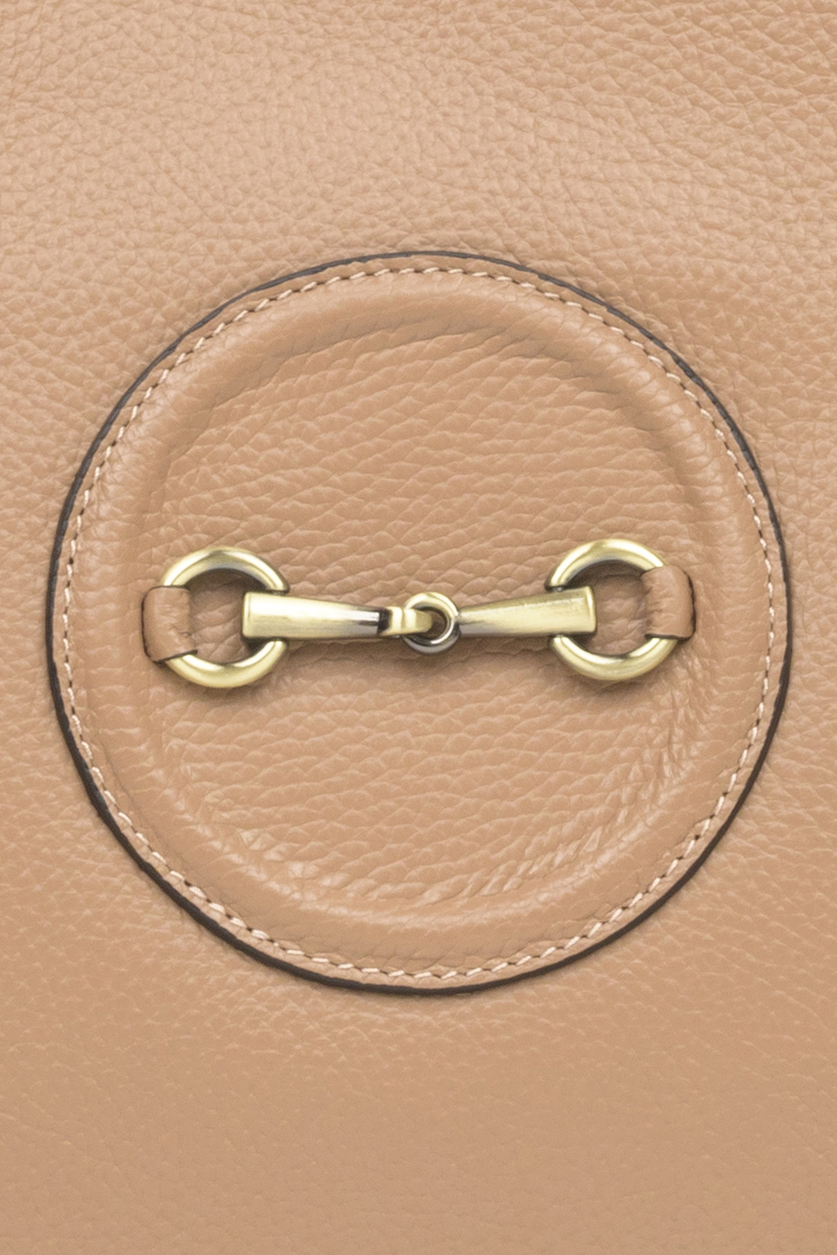 Spacious, beige leather women's handbag by Estro with gold accents - close-up on the details.