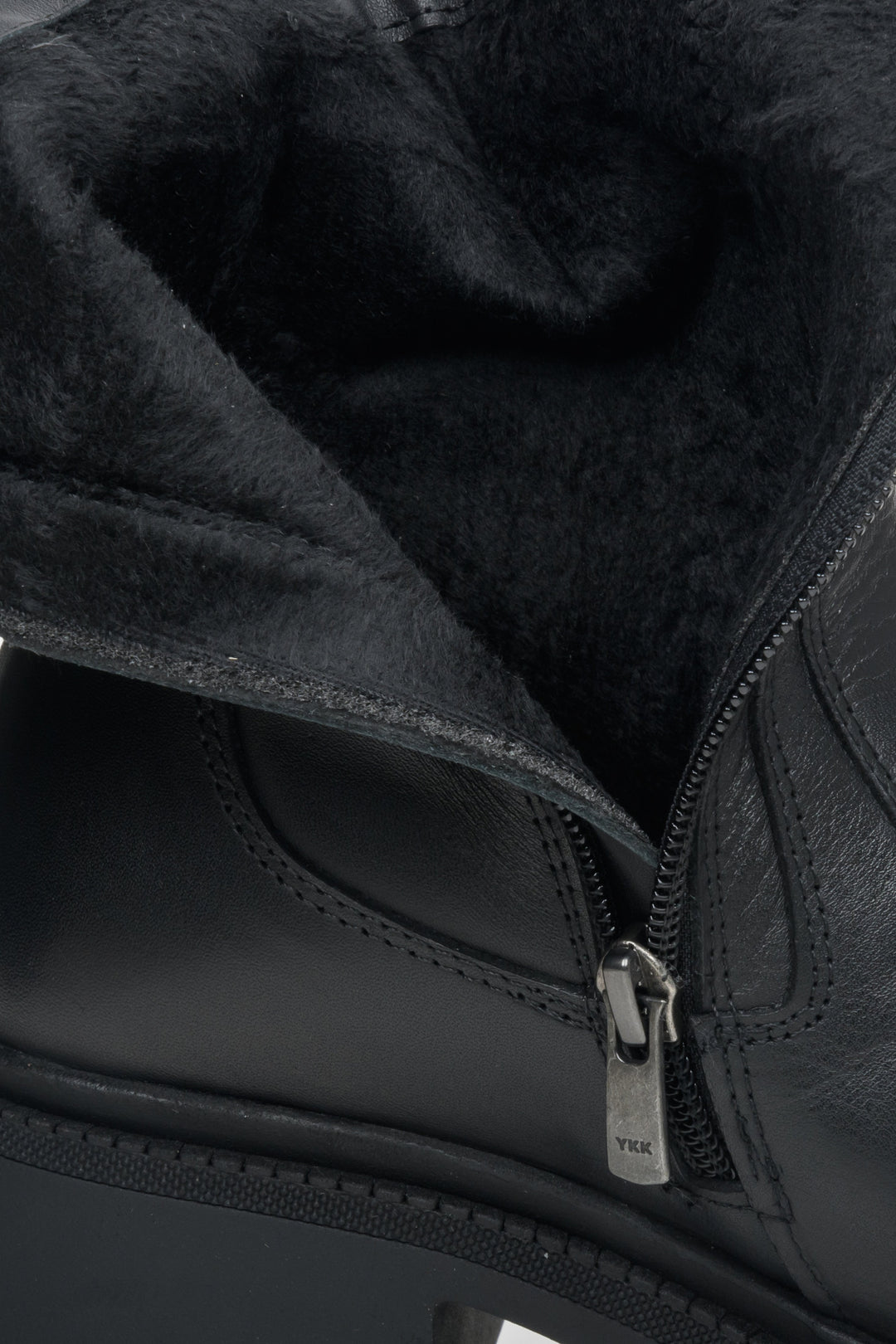 Women's black leather boots with a soft lining - close-up into the interior of the boot.