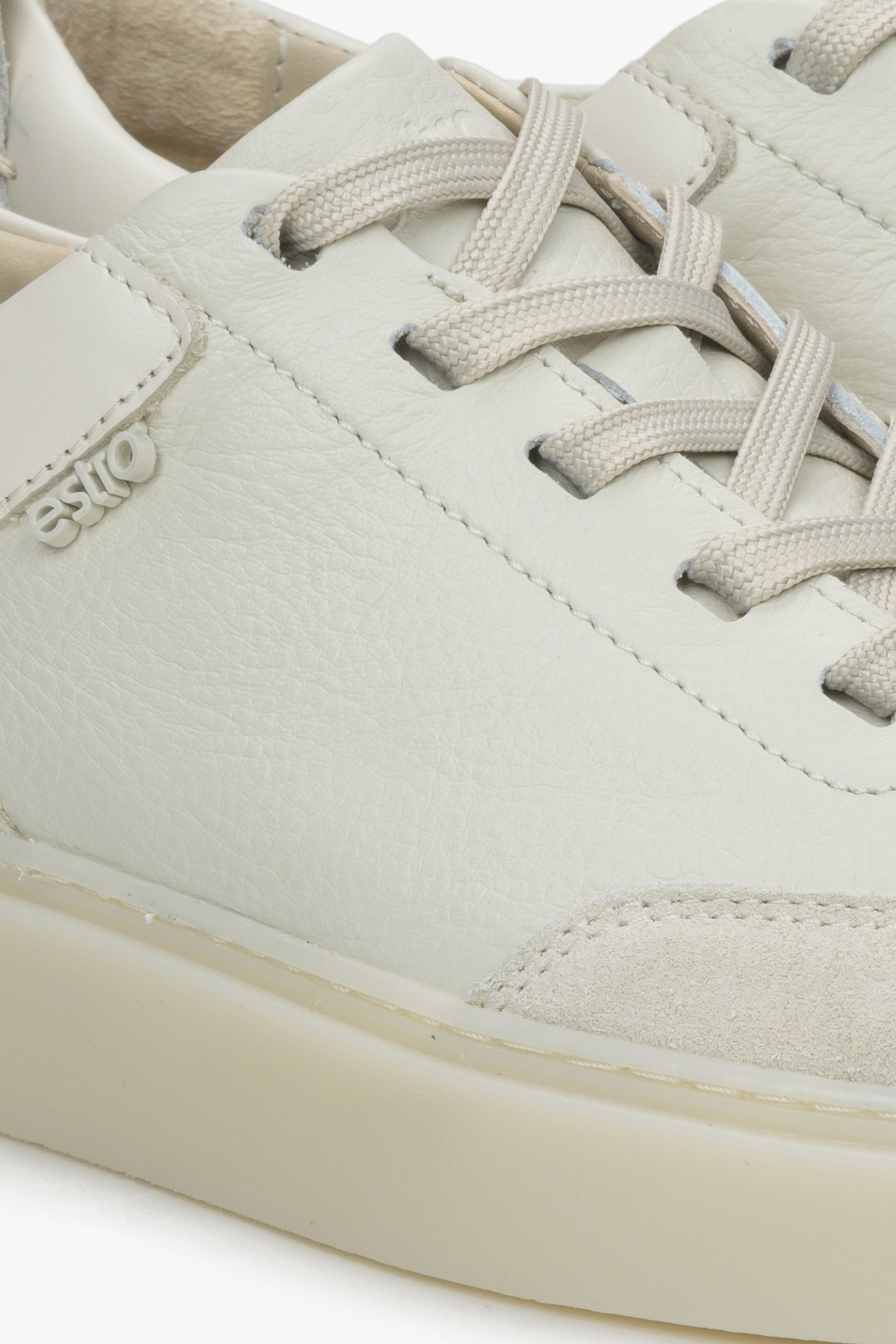 Beige women's sneakers made of genuine leather and velour by Estro - close-up on details.