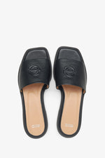 Women's black leather flip-flops by Estro - top view presentation of the model.