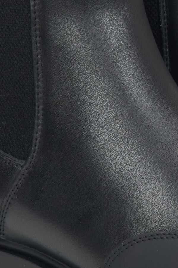 Women's black leather ankle boots Estro - close-up of the stitching and leather texture.