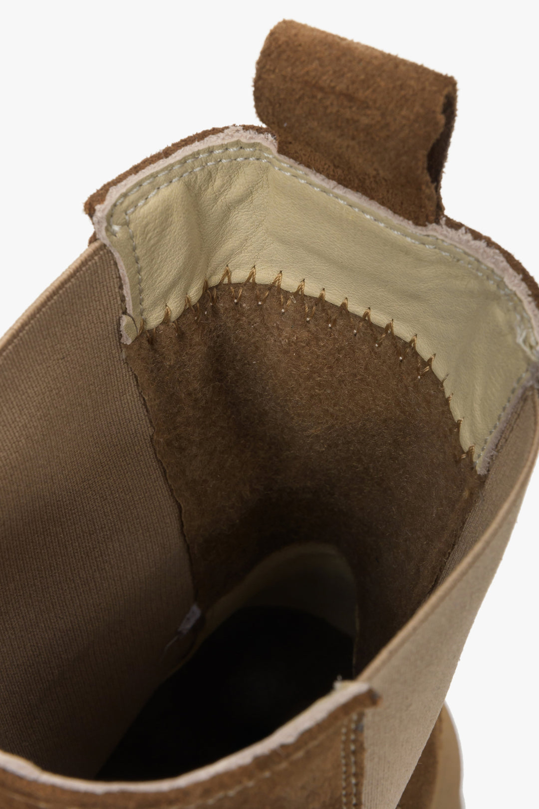 Elegant brown women's ankle boots natural velour - close-up of the shoe's interior.