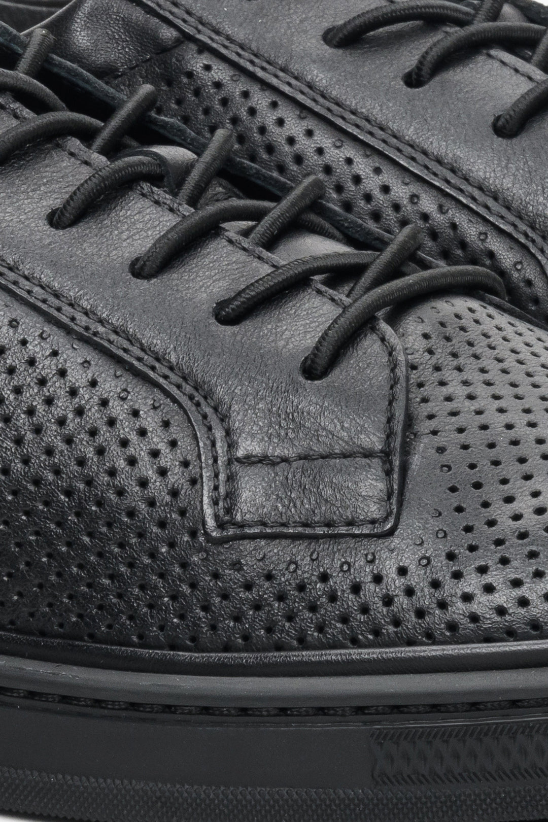 Estro men's sneakers in black with perforations and lacing for summer - close-up on details.