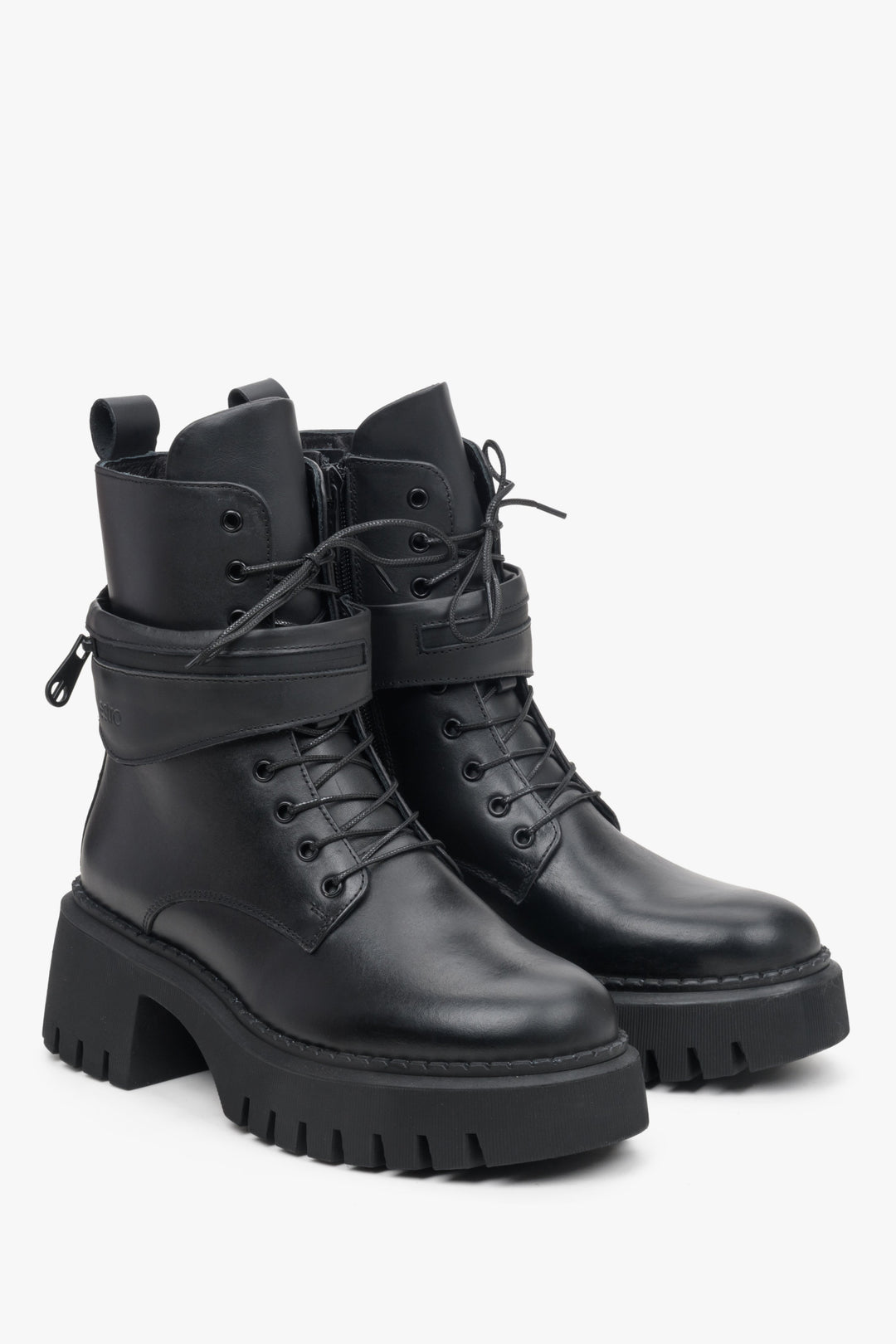 Leather women's winter boots by Estro with a decorative strap.