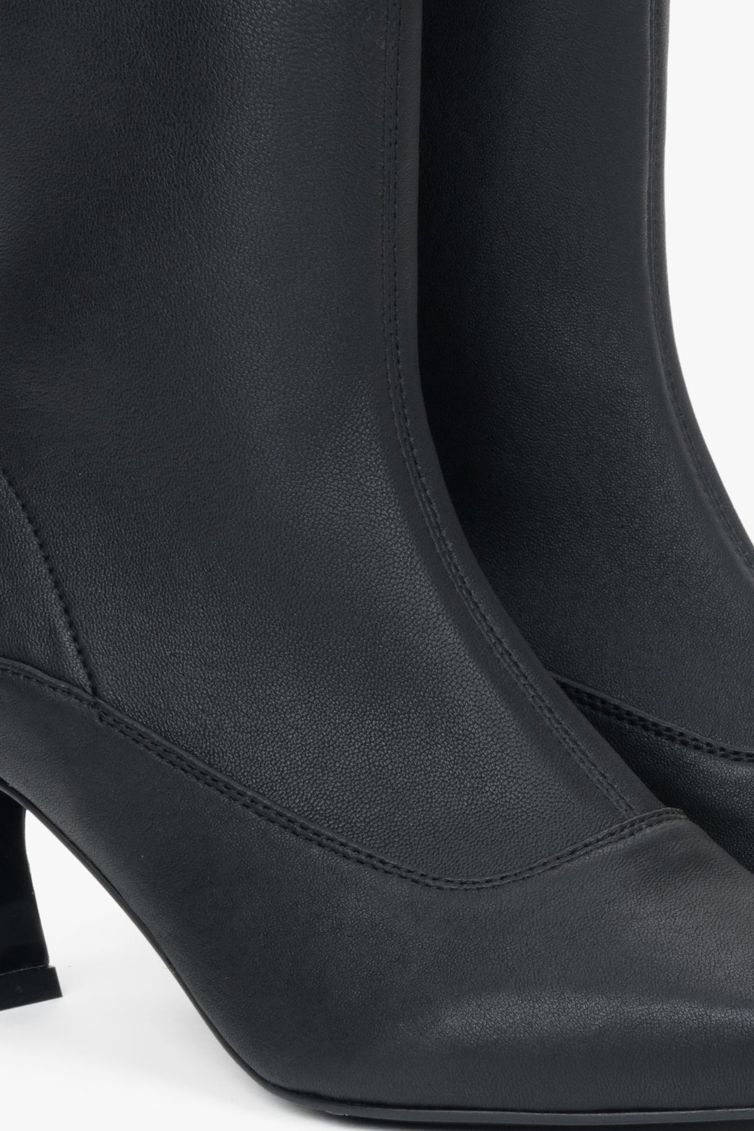 Black leather ankle boots with a heel by Estro - close-up of the details.