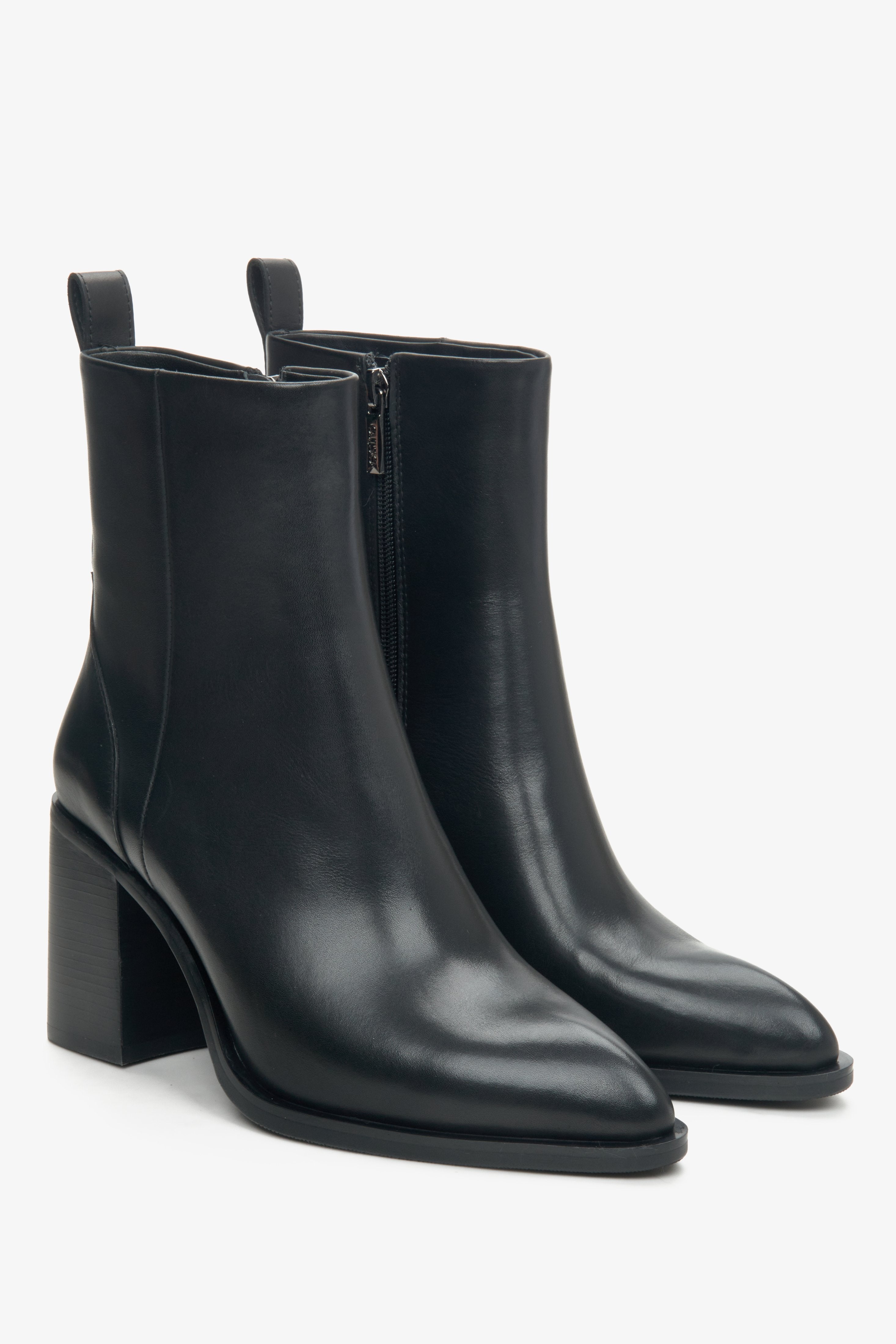 Women's black leather ankle boots by Estro with a pointed toe - close-up on the front and side of the boot.