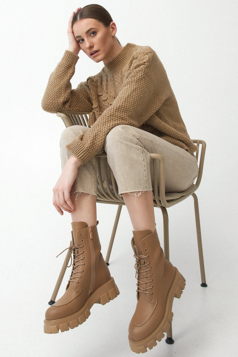 Women's brown leather boots lace-up - presentation on a model.