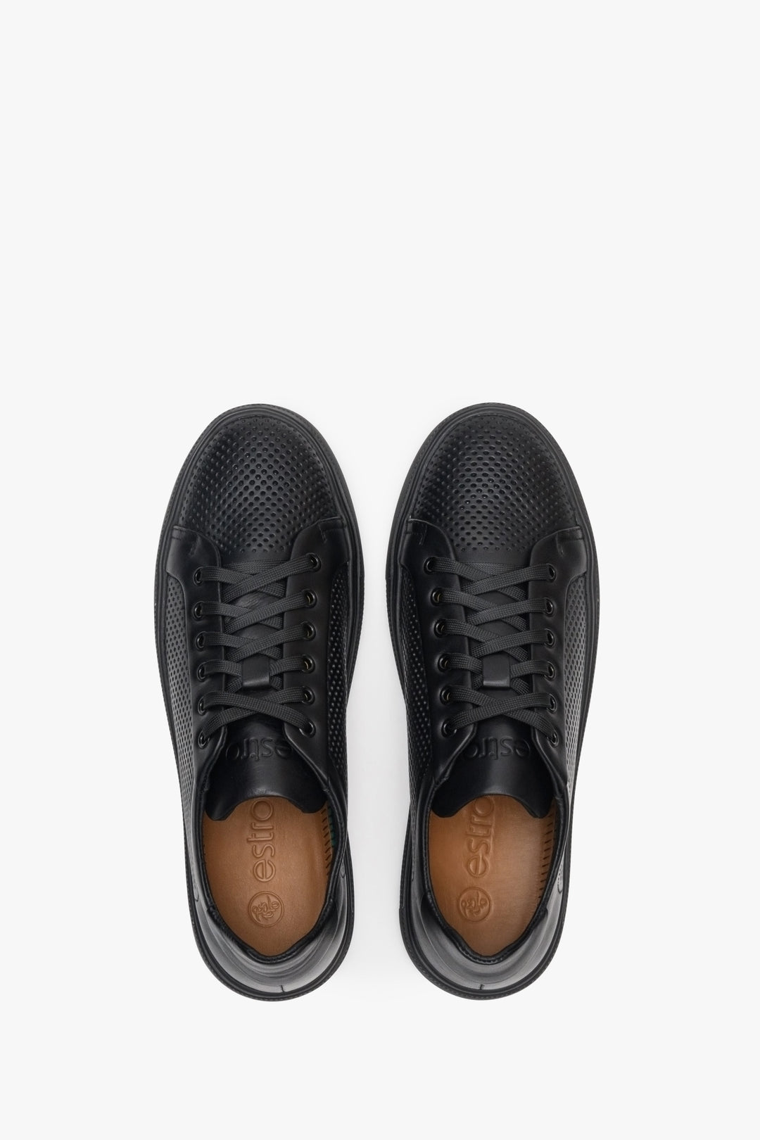 Men's black leather sneakers with perforations - top view presentation of the footwear.