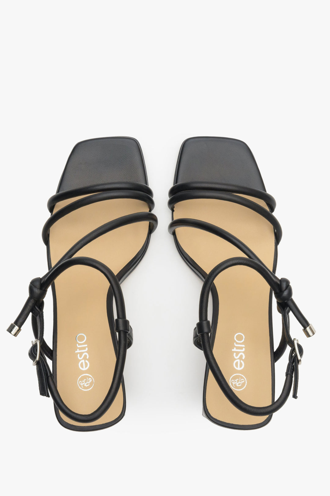 Women's strappy sandals in black on a block heel - presentation of the footwear from above.