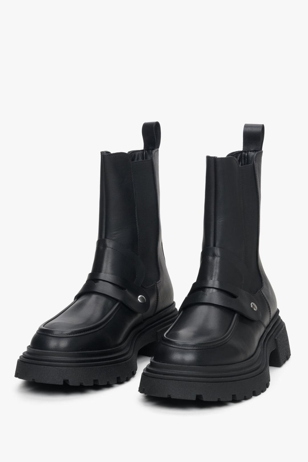 Women's black leather Chelsea boots by Estro - close-up on the front of the model.