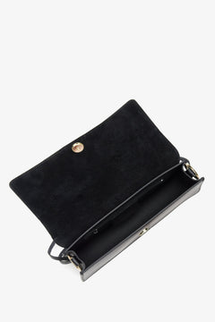 Women's black leather handbag - a close-up on the main compartment.