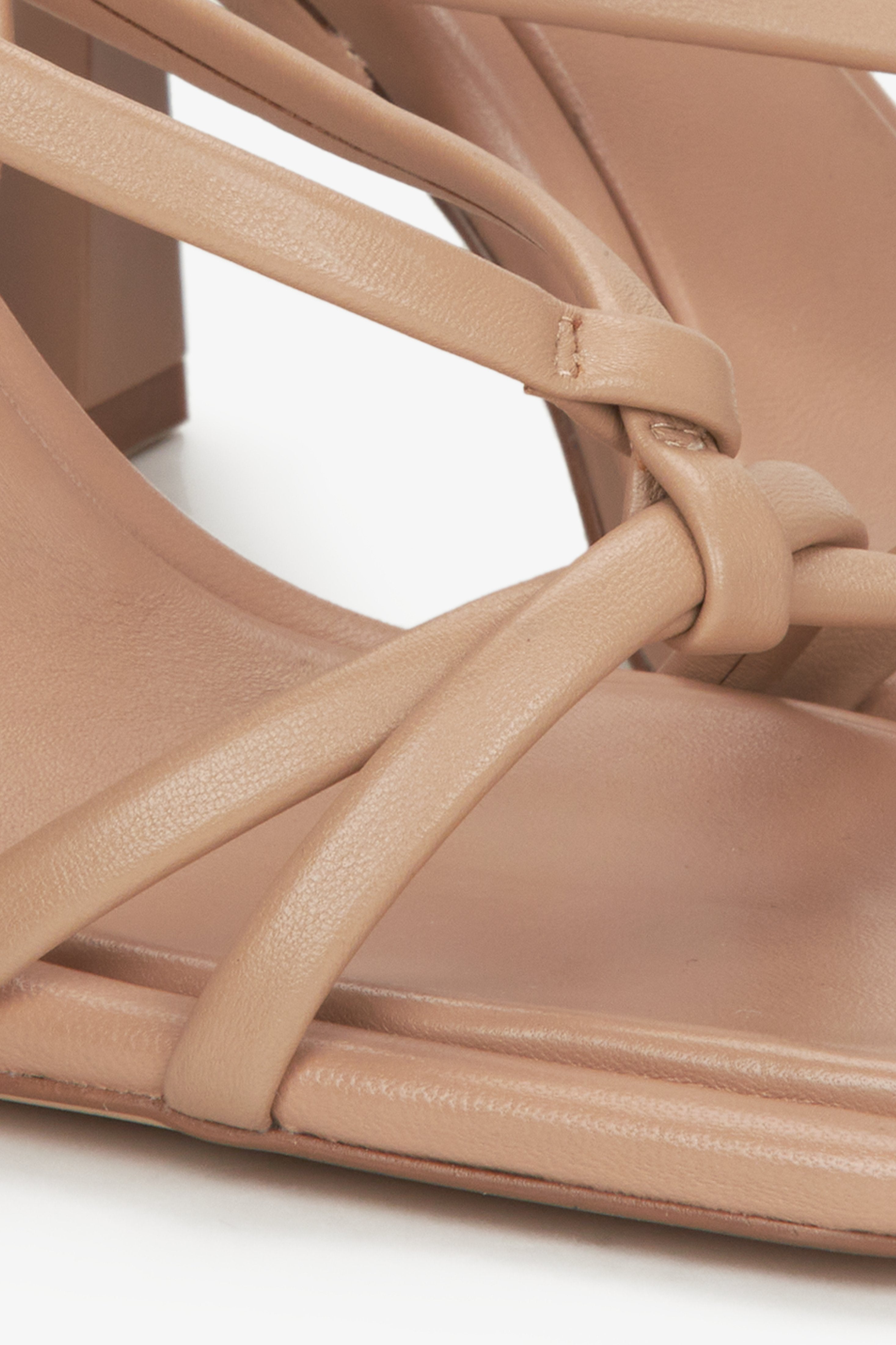 Women's beige sandals on a funnel heel, Estro brand - close-up on details.